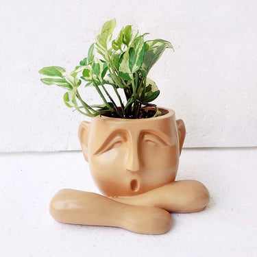 HUMAN RESTING SHOWPIECE CUM TABLE PLANTER : ORANGE