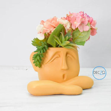 HUMAN RESTING SHOWPIECE CUM TABLE PLANTER : ORANGE