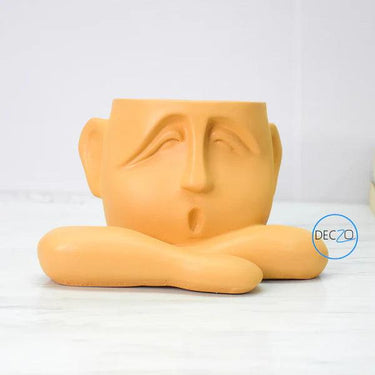 HUMAN RESTING SHOWPIECE CUM TABLE PLANTER : ORANGE